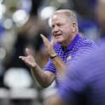 LSU head coach Brian Kelly encourages his team before an NCAA college football game against Florida State in New Orleans, Sunday, Sept. 4, 2022. (AP Photo/Gerald Herbert)
