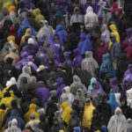 Fans exit Bill Snyder Family Stadium after a lightning delay was announced during the first half of an NCAA college football game between Kansas State and Missouri Saturday, Sept. 10, 2022, in Manhattan, Kan. (AP Photo/Charlie Riedel)