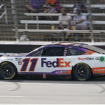 
              Denny Hamlin (11) drives during a NASCAR Cup Series auto race at Texas Motor Speedway in Fort Worth, Texas, Sunday, Sept. 25, 2022. (AP Photo/Larry Papke)
            