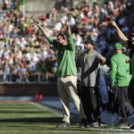 Oregon head coach Dan Lanning, left, signals his team during the second half of an NCAA college football game against Washington State, Saturday, Sept. 24, 2022, in Pullman, Wash. (AP Photo/Young Kwak)