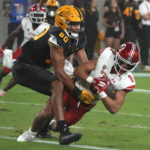 Utah safety Cole Bishop (8) intercepts a pass intended for Arizona State tight end Messiah Swinson (80) during the second half of an NCAA college football game Saturday, Sept. 24, 2022, in Tempe, Ariz. (AP Photo/Rick Scuteri)