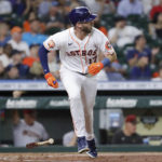 Houston Astros' David Hensley, watches his RBI single hit to left field, scoring Jose Altuve, during the fifth inning of a baseball game against the Arizona Diamondbacks Tuesday, Sept. 27, 2022, in Houston. (AP Photo/Michael Wyke)