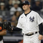 New York Yankees pitcher Zack Britton reacts after throwing a wild pitch during the sixth inning of the team's baseball game against the Baltimore Orioles on Friday, Sept. 30, 2022, in New York. (AP Photo/Adam Hunger)