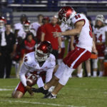 
              Miami (Ohio) place kicker Graham Nicholson (98) kicks the game-winning field goal against Northwestern from the hold of Alec Bevelhimer during the second half of an NCAA college football game Saturday, Sept. 24, 2022, in Evanston, Ill. (AP Photo/Matt Marton)
            