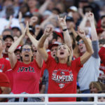 
              Northern Illinois fans cheer after a touchdown against Kentucky during the first half of an NCAA college football game in Lexington, Ky., Saturday, Sept. 24, 2022. (AP Photo/Michael Clubb)
            