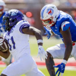 
              TCU wide receiver Derius Davis (11) runs past SMU defender Jamoi Hodge (6) during the second half of an NCAA college game on Saturday, Sept. 24, 2022, in Dallas, Texas. (AP Photo/Gareth Patterson)
            
