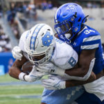 Georgia State safety Antavious Lane tackles North Carolina wide receiver Kobe Paysour in the second half of an NCAA college football game Saturday, Sept. 10, 2022, in Atlanta. (AP Photo/Hakim Wright Sr.)