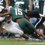 
              Minnesota's Mohamed Ibrahim, left, is tackled by Michigan State's Angelo Grose during the second quarter of an NCAA college football game, Saturday, Sept. 24, 2022, in East Lansing, Mich. (AP Photo/Al Goldis)
            