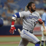Toronto Blue Jays' Raimel Tapia loses his helmet running to first against the Tampa Bay Rays during the third inning of a baseball game Sunday, Sept. 25, 2022, in St. Petersburg, Fla. (AP Photo/Scott Audette)