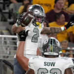 Eastern Michigan receiver Hassan Bedouin (2) celebrates his touchdown against Arizona State during the first half of an NCAA college football game Saturday, Sept. 17, 2022, in Tempe, Ariz. (AP Photo/Darryl Webb)
