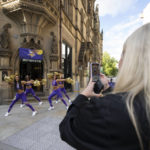 
              Cheerleaders for the The Minnesota Vikings record a TikTok video at a fan interaction event at The Brotherhood Of Pursuits And Pastimes sports bar in Manchester, England, Wednesday, Sept. 28, 2022. A half-dozen NFL teams are aggressively targeting fans in Britain now that they have new marketing rights in the country. They’re signing commercial deals and hiring local media personalities in bids to expand their fanbases and tap international revenue. (AP Photo/Jon Super)
            