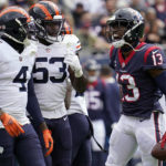 
              Houston Texans wide receiver Brandin Cooks (13) yells toward Chicago Bears' Eddie Jackson (4) and Nicholas Morrow (53) during the first half of an NFL football game Sunday, Sept. 25, 2022, in Chicago. (AP Photo/Nam Y. Huh)
            