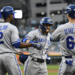 Kansas City Royals' Kyle Isbel, second from right, is congratualted after hitting a grand slam, scoring Nick Pratto, left, Michael A. Taylor and Ryan O'Hearn during the fifth inning of a baseball game against the Detroit Tigers, Saturday, Sept. 3, 2022, in Detroit. (AP Photo/Jose Juarez)