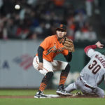 Arizona Diamondbacks' Jake McCarthy (30) steals second as San Francisco Giants second baseman Thairo Estrada waits for the throw from catcher Austin Wynns during the fifth inning of a baseball game in San Francisco, Friday, Sept. 30, 2022. (AP Photo/Godofredo A. Vásquez)