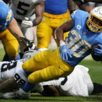 
              Los Angeles Chargers running back Austin Ekeler (30) runs against the Las Vegas Raiders during the second half of an NFL football game in Inglewood, Calif., Sunday, Sept. 11, 2022. (AP Photo/Marcio Jose Sanchez)
            