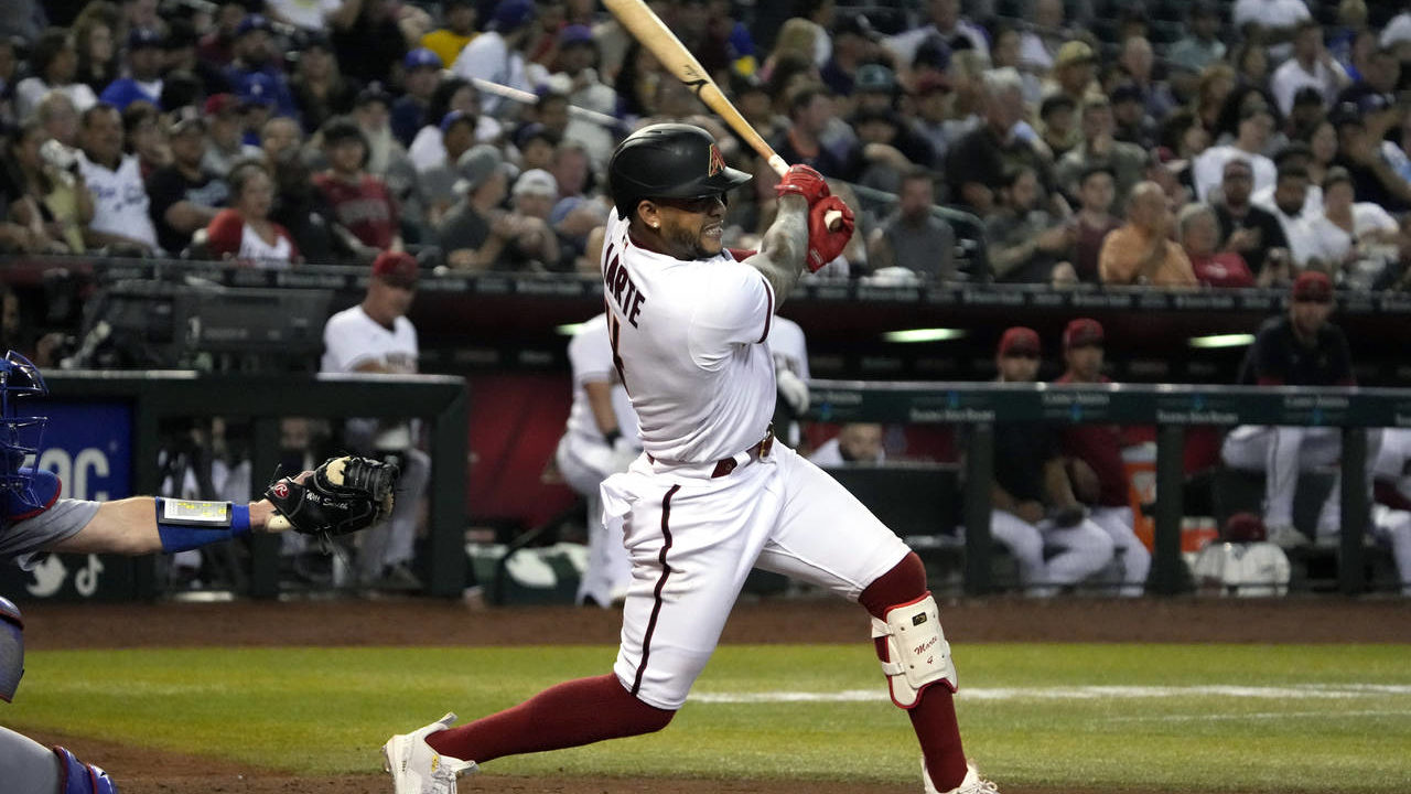 Arizona Diamondbacks' Ketel Marte hits a double against the Los Angeles Dodgers in the sixth inning...