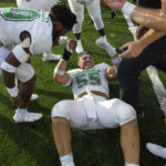 
              Marshall's Owen Porter (55) celebrates with teammates after the team defeated Notre Dame in an NCAA college football game Saturday, Sept. 10, 2022, in South Bend, Ind. Marshall won 26-21. (Sholten Singer/The Herald-Dispatch via AP)
            