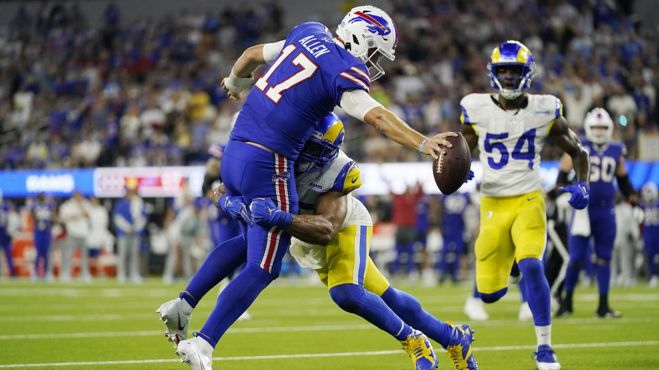 Buffalo Bills quarterback Josh Allen (17) lunges into the end zone for a touchdown over Los Angeles...