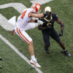 
              Clemson tight end Davis Allen (84) leaps over a Wake Forest defender as Wake Forest's Kobie Turner (0) defends during the first half of an NCAA college football game in Winston-Salem, N.C., Saturday, Sept. 24, 2022. (AP Photo/Chuck Burton)
            