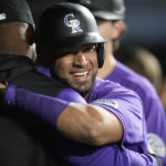 
              Colorado Rockies' Elias Diaz is congratulated as he returns to the dugout after hitting a two-run home run off Arizona Diamondbacks starting pitcher Zach Davies during the second inning of a baseball game Friday, Sept. 9, 2022, in Denver. (AP Photo/David Zalubowski)
            