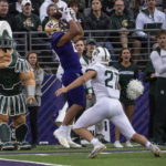 
              Washington running back Wayne Taulapapa, left, makes reception for a touchdown against Michigan State linebacker Cal Haladay during the first half of an NCAA college football game, Saturday, Sept. 17, 2022, in Seattle. (AP Photo/Stephen Brashear)
            