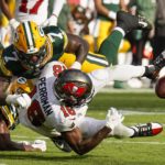 Tampa Bay Buccaneers' Breshad Perriman fumbles after catching a pass during the first half of an NFL football game against the Green Bay Packers Sunday, Sept. 25, 2022, in Tampa, Fla. (AP Photo/Chris O'Meara)