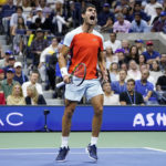 
              Carlos Alcaraz, of Spain, reacts after scoring a point against Casper Ruud, of Norway, during the men's singles final of the U.S. Open tennis championships, Sunday, Sept. 11, 2022, in New York. (AP Photo/John Minchillo)
            