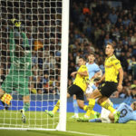 Manchester City's Erling Haaland, right on the pitch scores his side's 2nd goal during the group G Champions League soccer match between Manchester City and Borussia Dortmund at the Etihad stadium in Manchester, England, Wednesday, Sept. 14, 2022. (AP Photo/Dave Thompson)