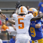 
              Pittsburgh quarterback Kedon Slovis (9) gets a pass away and complete to tight end Gavin Bartholomew (86) as Tennessee defensive back Kamal Hadden (5) pressures him during the first half of an NCAA college football game, Saturday, Sept. 10, 2022, in Pittsburgh. (AP Photo/Keith Srakocic)
            