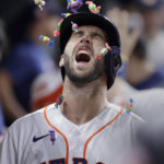 Houston Astros designated hitter David Hensley reacts as bubble gum is thrown on his head in the dugout during a celebration of his two run home run against the Arizona Diamondbacks during the sixth inning of a baseball game Tuesday, Sept. 27, 2022, in Houston. (AP Photo/Michael Wyke)