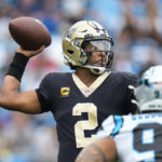 New Orleans Saints quarterback Jameis Winston (2) sets back to pass the ball during the first half of an NFL football game against the Carolina Panthers, Sunday, Sept. 25, 2022, in Charlotte, N.C. (AP Photo/Rusty Jones)