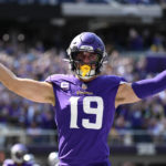 
              Minnesota Vikings wide receiver Adam Thielen (19) celebrates after catching a 1-yard touchdown pass during the first half of an NFL football game against the Detroit Lions, Sunday, Sept. 25, 2022, in Minneapolis. (AP Photo/Craig Lassig)
            