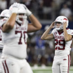 
              Arkansas place-kicker Cam Little (29) reacts after missing a field goal against Texas A&M in the final minutes of an NCAA college football game Saturday, Sept. 24, 2022, in Arlington, Texas. Texas A&M won 23-21. (AP Photo/Brandon Wade)
            