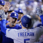 Los Angeles Dodgers' Freddie Freeman celebrates his home run against the Arizona Diamondbacks during the third inning of a baseball game in Phoenix, Tuesday, Sept. 13, 2022. (AP Photo/Ross D. Franklin)