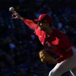 Philadelphia Phillies relief pitcher Connor Brogdon delivers in the late afternoon sun during the eighth inning of a baseball game against the Chicago Cubs, Thursday, Sept. 29, 2022, in Chicago. (AP Photo/Charles Rex Arbogast)