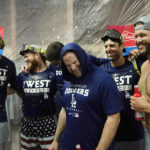 Los Angeles Dodgers' Joey Gallo, Craig Kimbrel, Max Muncy, Chris Taylor and Clayton Kershaw, from left, celebrate in the locker room after the team's 4-0 win in a baseball game against the Arizona Diamondbacks in Phoenix, Tuesday, Sept. 13, 2022. The Dodgers clinched the National League West. (AP Photo/Ross D. Franklin)