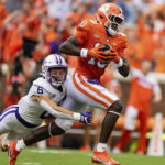 
              Furman Paladins safety Hugh Ryan (6) tackles Clemson Tigers wide receiver Joseph Ngata in the first quarter during an NCAA college football game in Clemson, S.C., Saturday, Sept. 10, 2022. (AP Photo/Jacob Kupferman)
            