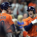 Houston Astros' Alex Bregman (2) celebrates with Kyle Tucker (30) after hitting a home run against the Tampa Bay Rays during the first inning of a baseball game Friday, Sept. 30, 2022, in Houston. (AP Photo/David J. Phillip)