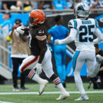
              Cleveland Browns running back Kareem Hunt scores past Carolina Panthers safety Xavier Woods during the first half of an NFL football game on Sunday, Sept. 11, 2022, in Charlotte, N.C. (AP Photo/Rusty Jones)
            