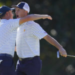 
              Jordan Spieth and Justin Thomas celebrate after winning the match during their fourball match at the Presidents Cup golf tournament at the Quail Hollow Club, Friday, Sept. 23, 2022, in Charlotte, N.C. (AP Photo/Julio Cortez)
            