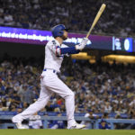 
              Los Angeles Dodgers' Cody Bellinger hits a three-run home run during the fourth inning of a baseball game against the Colorado Rockies Friday, Sept. 30, 2022, in Los Angeles. (AP Photo/Mark J. Terrill)
            