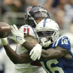 Houston Texans cornerback Steven Nelson (21) breaks up a pass to Indianapolis Colts wide receiver Ashton Dulin (16) during the second half of an NFL football game Sunday, Sept. 11, 2022, in Houston. (AP Photo/Eric Christian Smith)