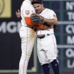 Houston Astros' Jeremy Pena, left, and Jose Altuve hug after the team's 10-2 win over the Arizona Diamondbacks in a baseball game Tuesday, Sept. 27, 2022, in Houston. (AP Photo/Michael Wyke)