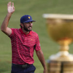 
              Max Homa walks to the 15th green after the USA team won the singles match at the Presidents Cup golf tournament at the Quail Hollow Club, Sunday, Sept. 25, 2022, in Charlotte, N.C. (AP Photo/Chris Carlson)
            