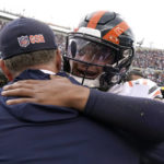 Chicago Bears quarterback Justin Fields, right, hugs coach Matt Eberflus after an NFL football game against the Houston Texans Sunday, Sept. 25, 2022, in Chicago. The Bears won 23-20. (AP Photo/Nam Y. Huh)