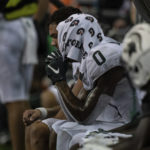 Michigan State wide receiver Keon Coleman sits on the bench with a towel on his head late in the second half of an NCAA college football game against Washington, Saturday, Sept. 17, 2022, in Seattle. (AP Photo/Stephen Brashear)