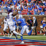 TCU wide receiver Savion Williams (18) catches a touchdown pass over SMU's Ar'mani Johnson (5) during the first half of an NCAA college game on Saturday, Sept. 24, 2022, in Dallas, Texas. (AP Photo/Gareth Patterson)