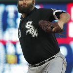 
              Chicago White Sox starting pitcher Lance Lynn throws to the Minnesota Twins in the first inning of a baseball game Tuesday, Sept. 27, 2022, in Minneapolis. (AP Photo/Bruce Kluckhohn)
            