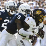 Penn State cornerback Joey Porter Jr. (9) tackles Central Michigan running back Lew Nichols III (7) during the second half of an NCAA college football game, Saturday, Sept. 24, 2022, in State College, Pa. (AP Photo/Barry Reeger)