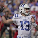 
              Duke quarterback Riley Leonard (13) looks to pass during the first half of an NCAA college football game against Kansas Saturday, Sept. 24, 2022, in Lawrence, Kan. (AP Photo/Charlie Riedel)
            